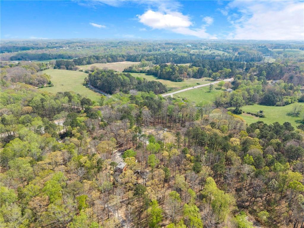 970 GA Highway 211 Winder, GA 30680 - Photo 59 of 60 an aerial view of residential houses with outdoor space and trees