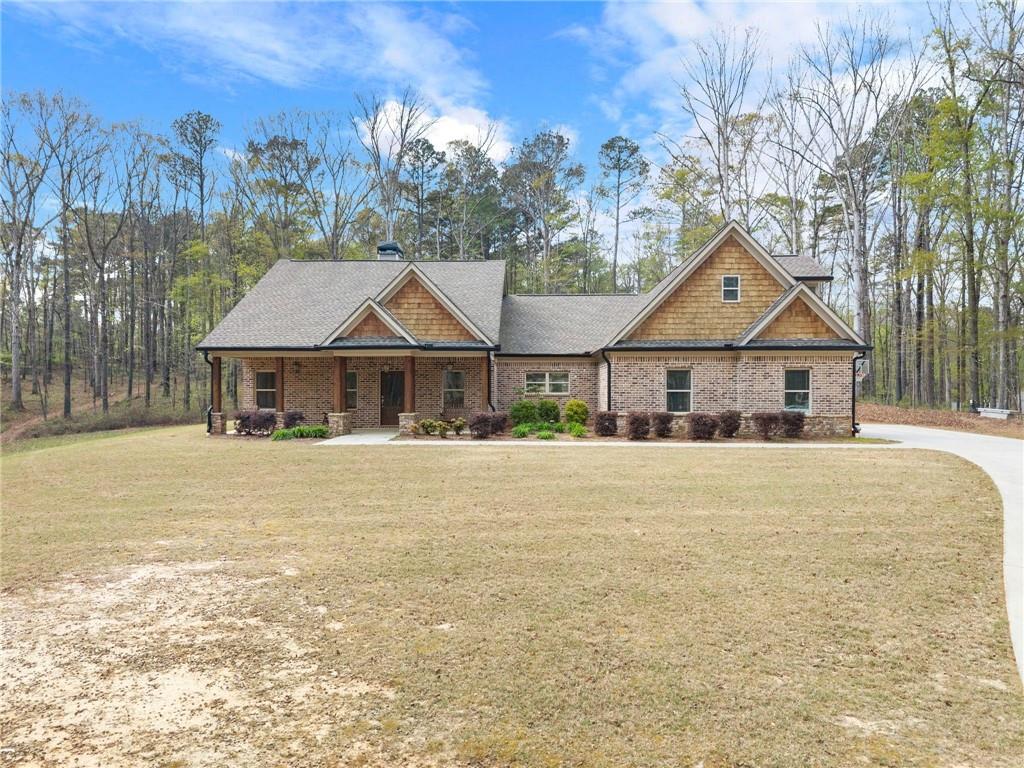 970 GA Highway 211 Winder, GA 30680 - Photo 6 of 60 a front view of a house with a yard and tree s