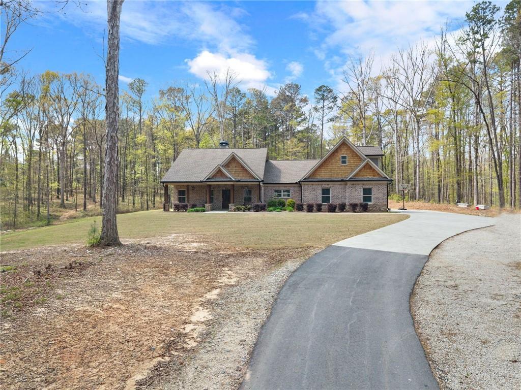 970 GA Highway 211 Winder, GA 30680 - Photo 9 of 60 a front view of a house with a yard