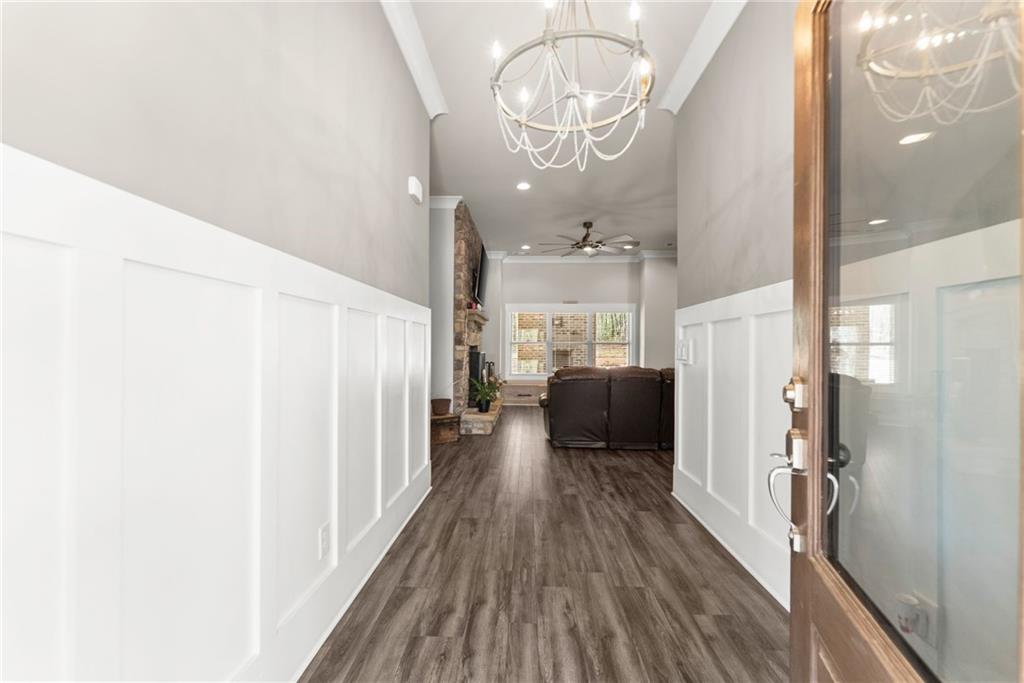 970 GA Highway 211 Winder, GA 30680 - Photo 10 of 60 a view of a hallway with wooden floor and staircase