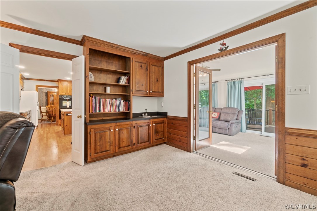 13903 Beechwood Point Road Midlothian, VA 23112 - Photo 15 of 33 a room with furniture and a book shelf