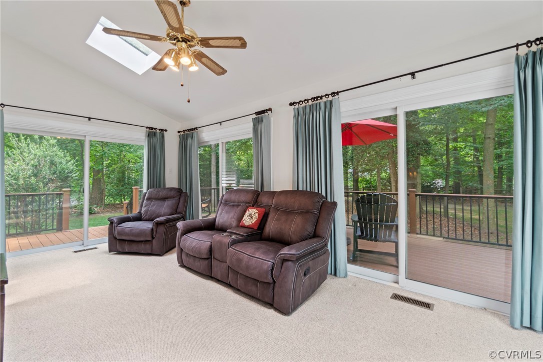 13903 Beechwood Point Road Midlothian, VA 23112 - Photo 16 of 33 a living room with furniture ceiling fan and a large window