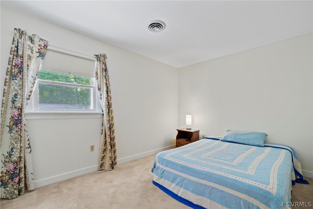 13903 Beechwood Point Road Midlothian, VA 23112 - Photo 19 of 33 a bedroom with a bed and a window