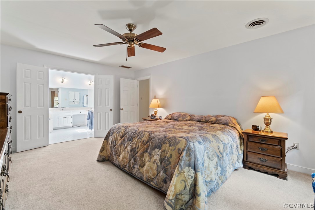 13903 Beechwood Point Road Midlothian, VA 23112 - Photo 23 of 33 a bedroom with a bed and a chandelier
