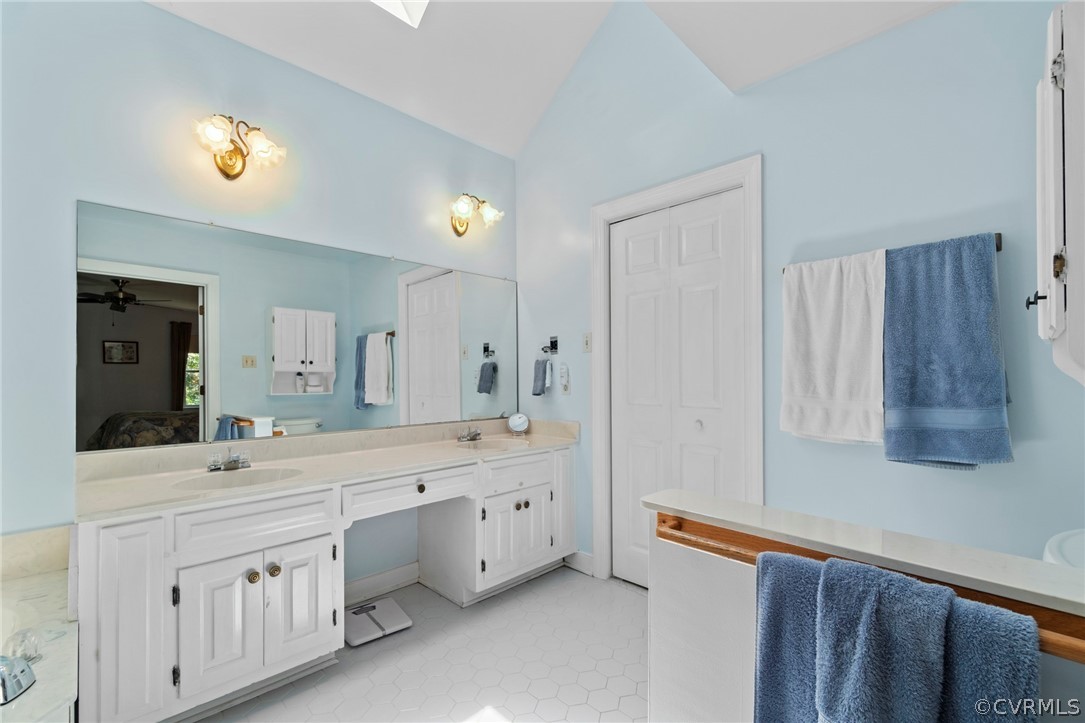 13903 Beechwood Point Road Midlothian, VA 23112 - Photo 24 of 33 a spacious bathroom with a double vanity sink a mirror and a bathtub