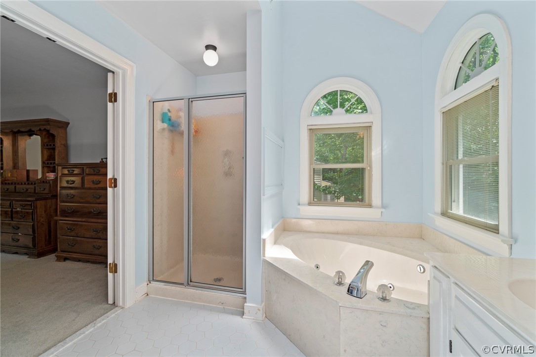 13903 Beechwood Point Road Midlothian, VA 23112 - Photo 25 of 33 a bath room with a bath tub and a window