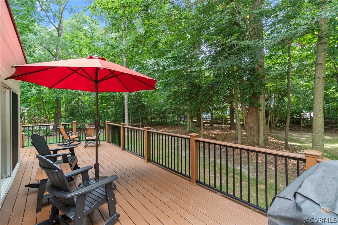 13903 Beechwood Point Road Midlothian, VA 23112 - Photo 29 of 33 a view of a balcony with chairs and wooden floor