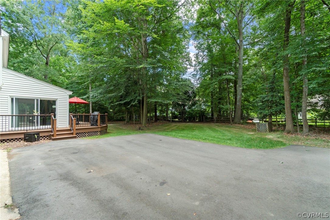 13903 Beechwood Point Road Midlothian, VA 23112 - Photo 33 of 33 a view of a house with backyard and trees