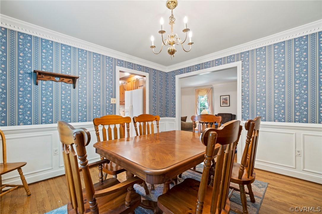13903 Beechwood Point Road Midlothian, VA 23112 - Photo 7 of 33 a view of a dining room with furniture window and wooden floor