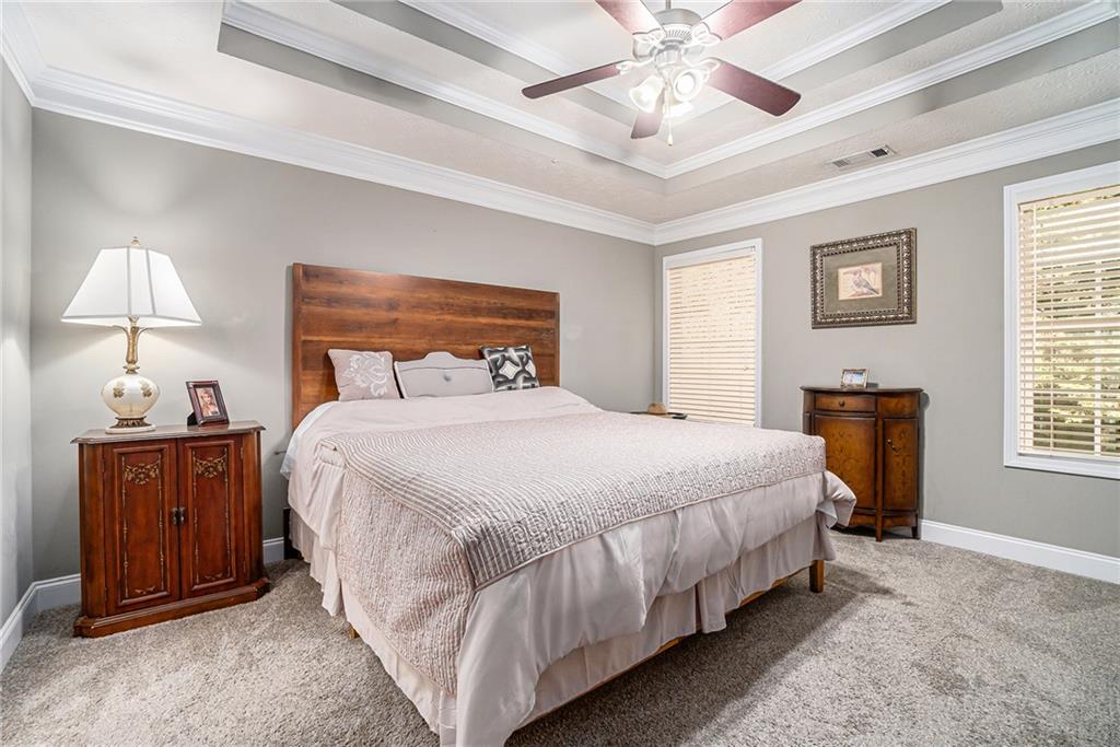 21 Cartee Lane Dallas, GA 30157 - Photo 18 of 29 a bedroom with a bed and a lamp on dresser