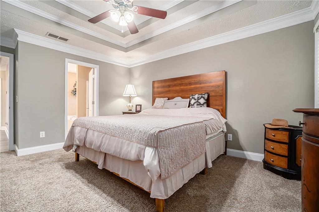 21 Cartee Lane Dallas, GA 30157 - Photo 19 of 29 a bedroom with a bed and a chandelier