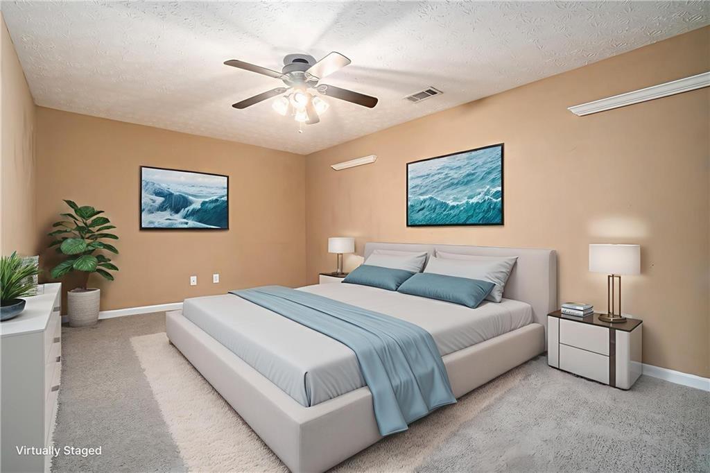 21 Cartee Lane Dallas, GA 30157 - Photo 22 of 29 a bedroom with a large bed and a chandelier