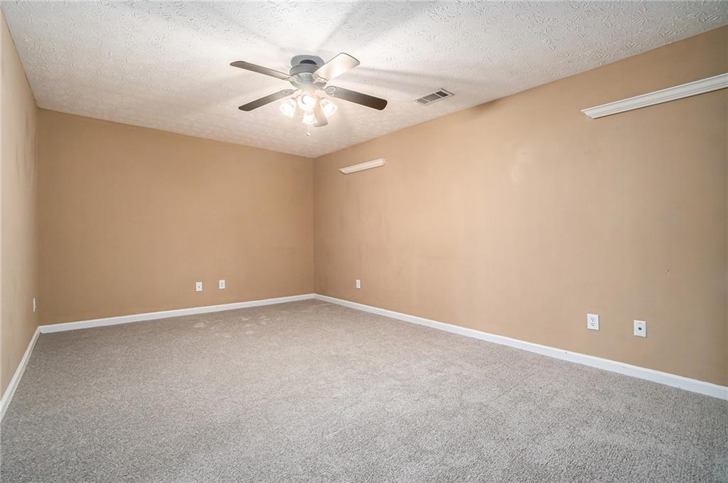 21 Cartee Lane Dallas, GA 30157 - Photo 23 of 29 an empty room with windows and fan