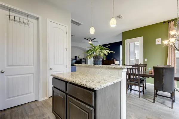 a view of kitchen island kitchen island dining table and chairs