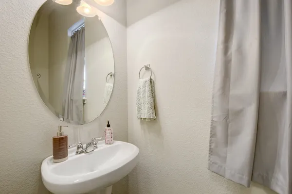a bathroom with a sink and mirror