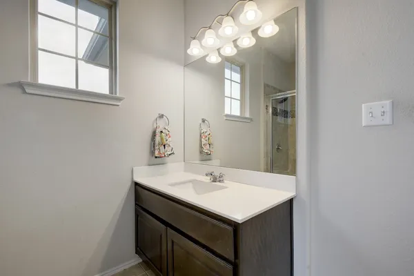 a bathroom with a sink and a mirror
