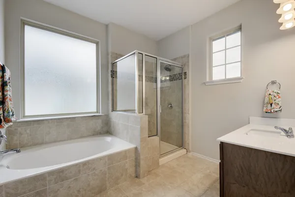 a bathroom with a bathtub and a sink