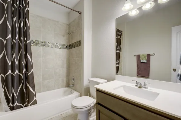 a bathroom with a sink a toilet and a bathtub