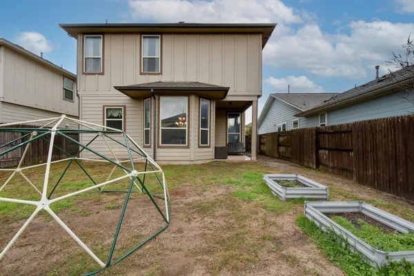 a house view with a backyard space