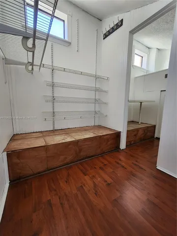 a view of a room with racks on the wall