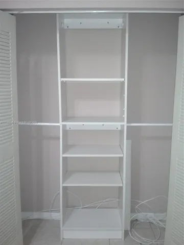 a view of a backyard with sitting area