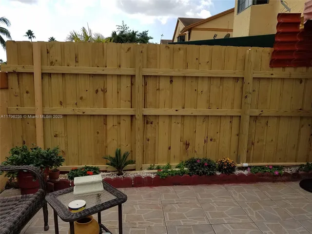 a view of swimming pool with outdoor seating