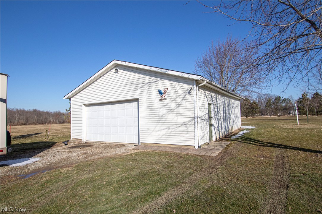 9459 Stone Road Litchfield, OH 44253 - Photo 32 of 50 View of yard with a garage
