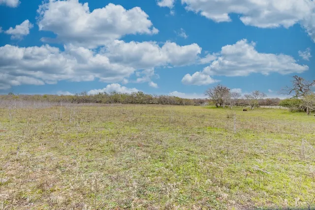 a view of a lake with houses in the background