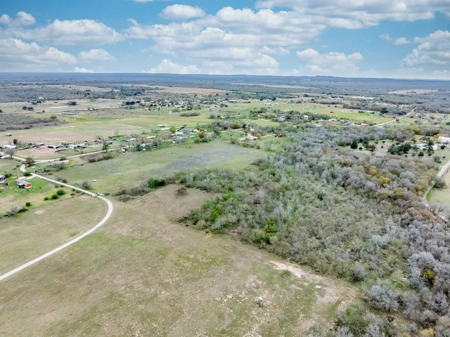 a view of a field with an ocean view