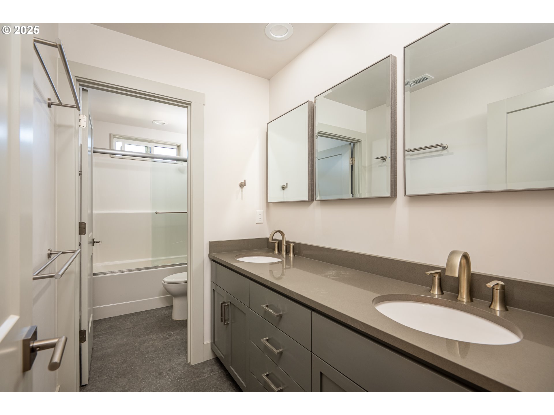 3352 Zane Lane Eugene, OR 97404 - Photo 12 of 42 a bathroom with a granite countertop sink toilet a large mirror and shower