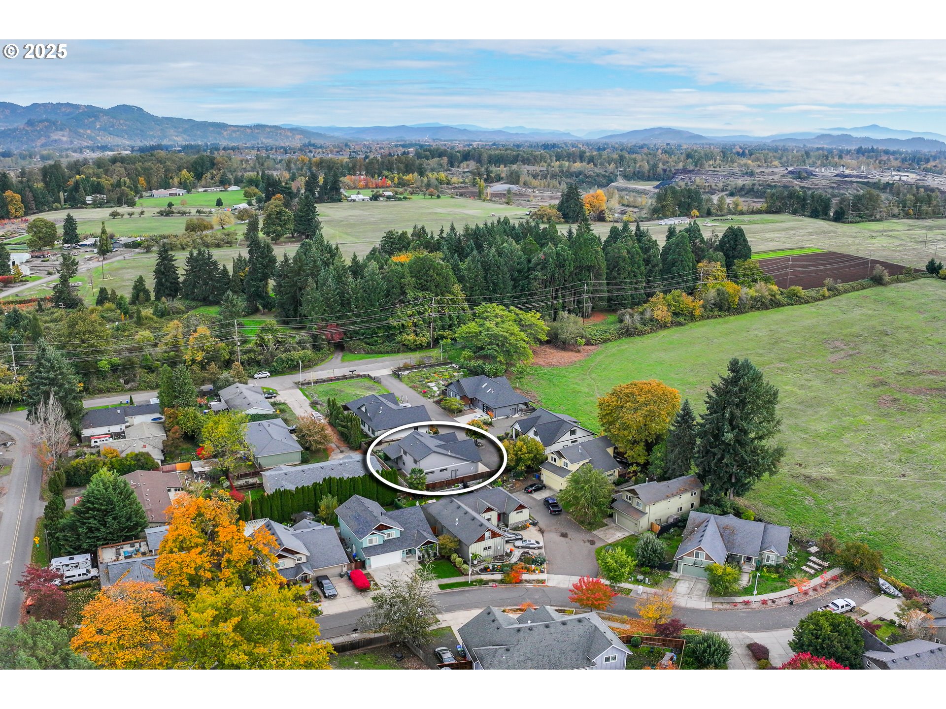 3352 Zane Lane Eugene, OR 97404 - Photo 34 of 42 an aerial view of a house with garden space and mountain view in back