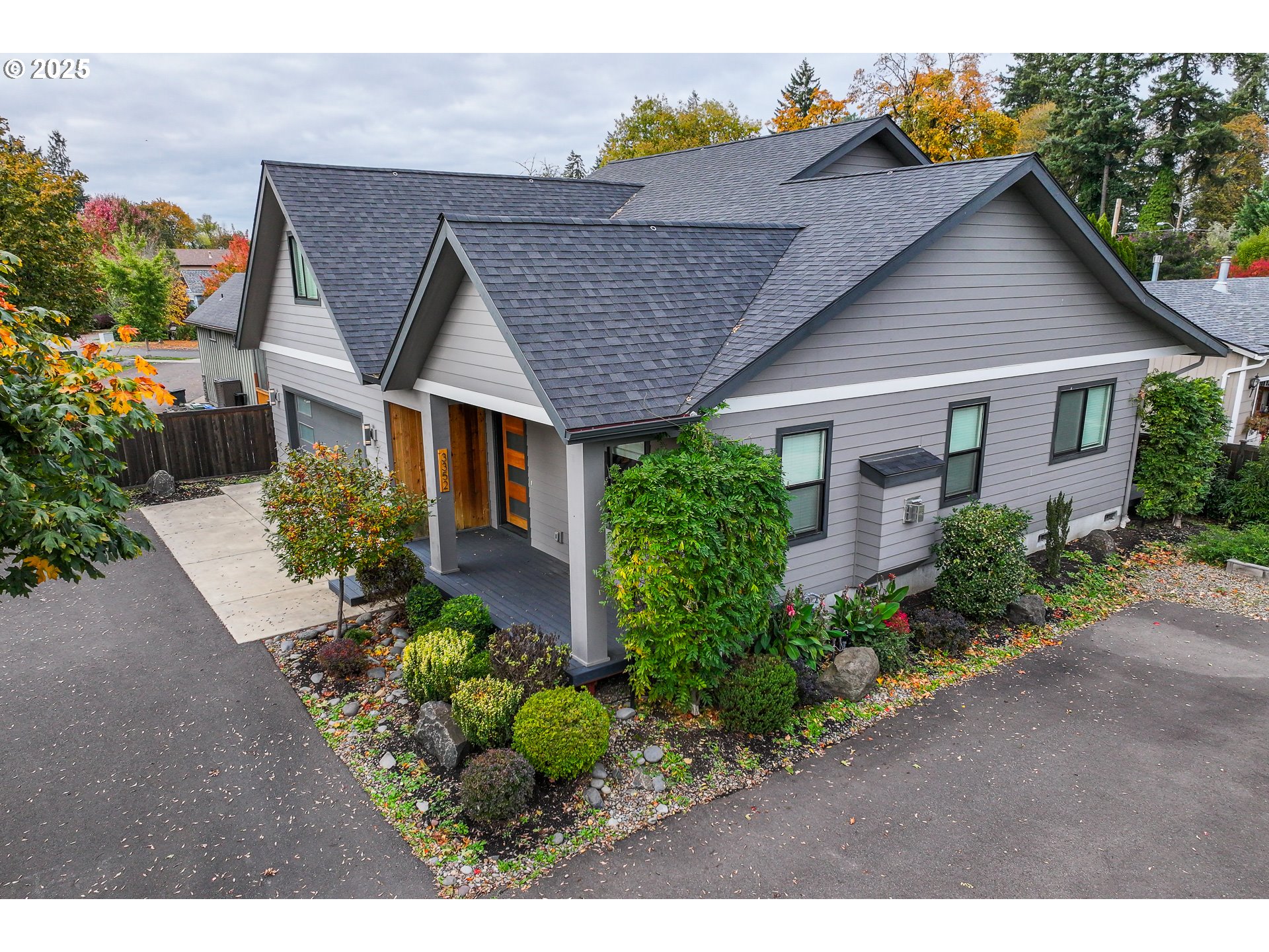 3352 Zane Lane Eugene, OR 97404 - Photo 36 of 42 a aerial view of a house with a yard and potted plants