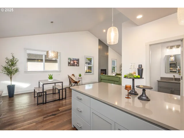 a bathroom with a sink a mirror and a large window