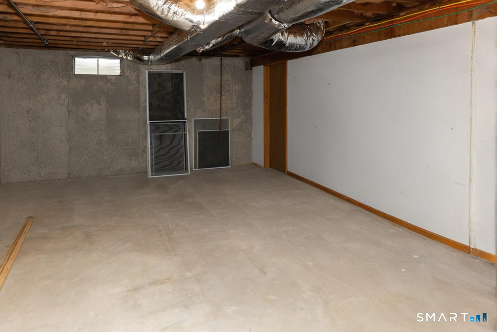 10 Runnymede Lane, Unit 10 Madison, CT 06443 - Photo 18 of 28 Basement area is huge and also includes a cedar closet. Plenty off storage room!