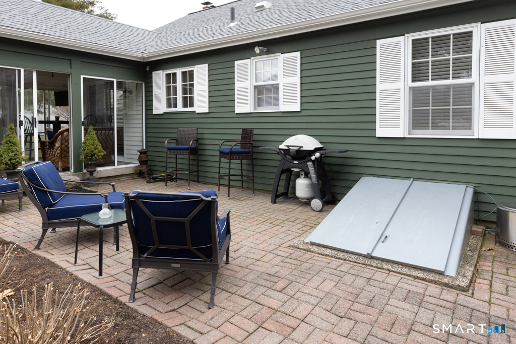 10 Runnymede Lane, Unit 10 Madison, CT 06443 - Photo 23 of 33 Lovely private patio off of the sunroom.