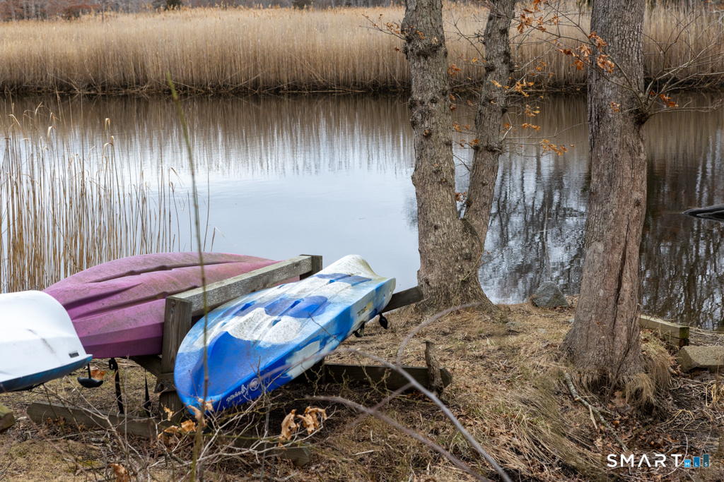 10 Runnymede Lane, Unit 10 Madison, CT 06443 - Photo 27 of 33 Canoe storage area
