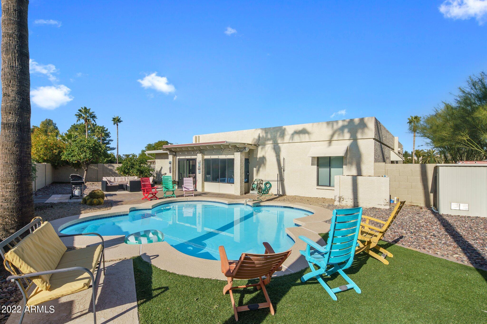 6609 East Phelps Road Scottsdale, AZ 85254 - Photo 67 of 83 a view of a house with backyard porch and sitting area