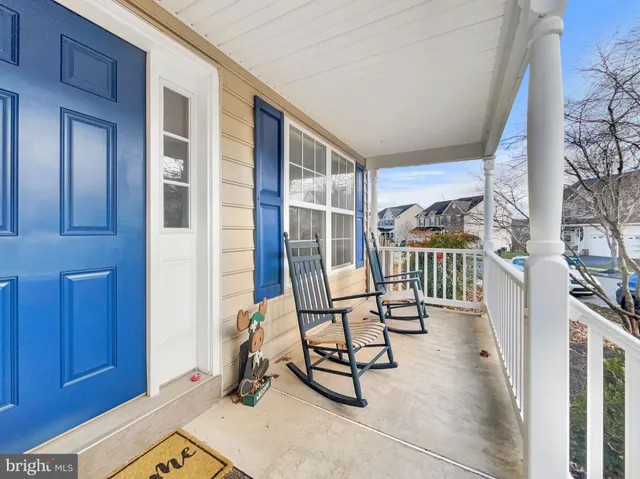 a view of a chairs and bench in the porch