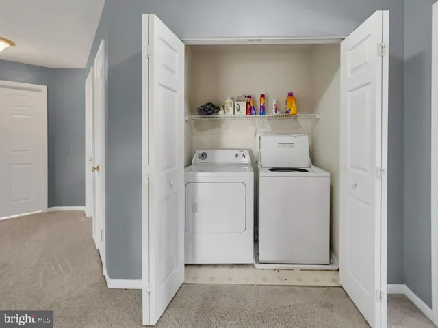 a view of storage and utility room with washer and dryer
