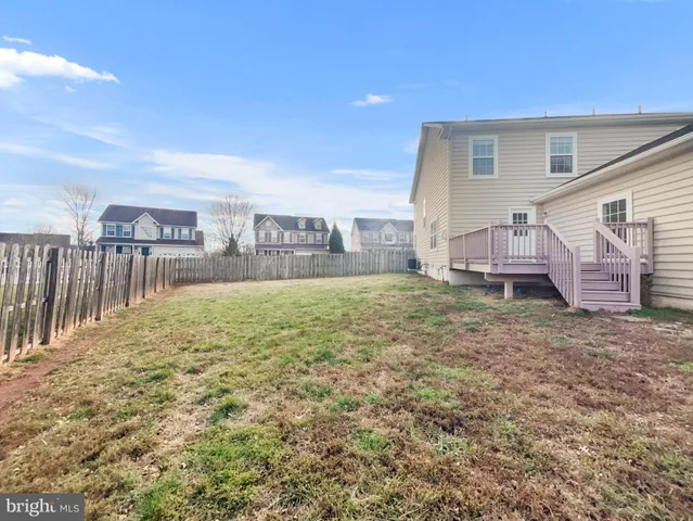 a view of a backyard of the house
