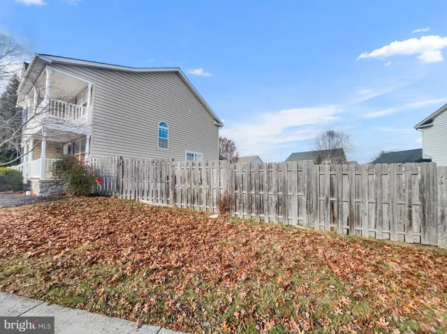 a house view with wooden fence