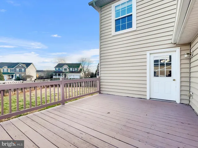 a view of a balcony with wooden floor