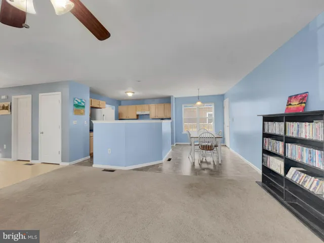 a view of a livingroom with furniture and a window