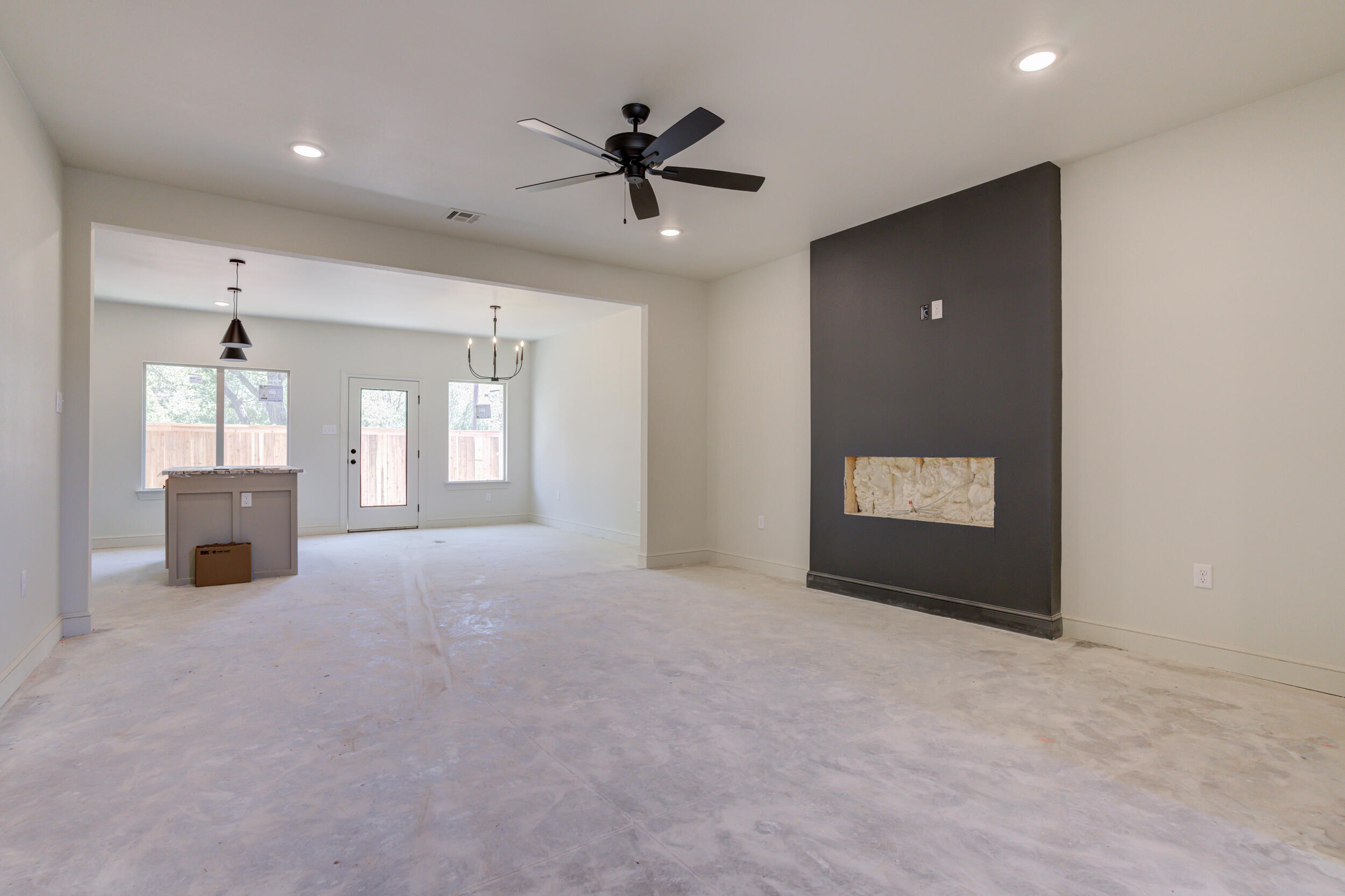 3423 24th Street Lubbock, TX 79410 - Photo 13 of 45 a view of a livingroom with a ceiling fan and window