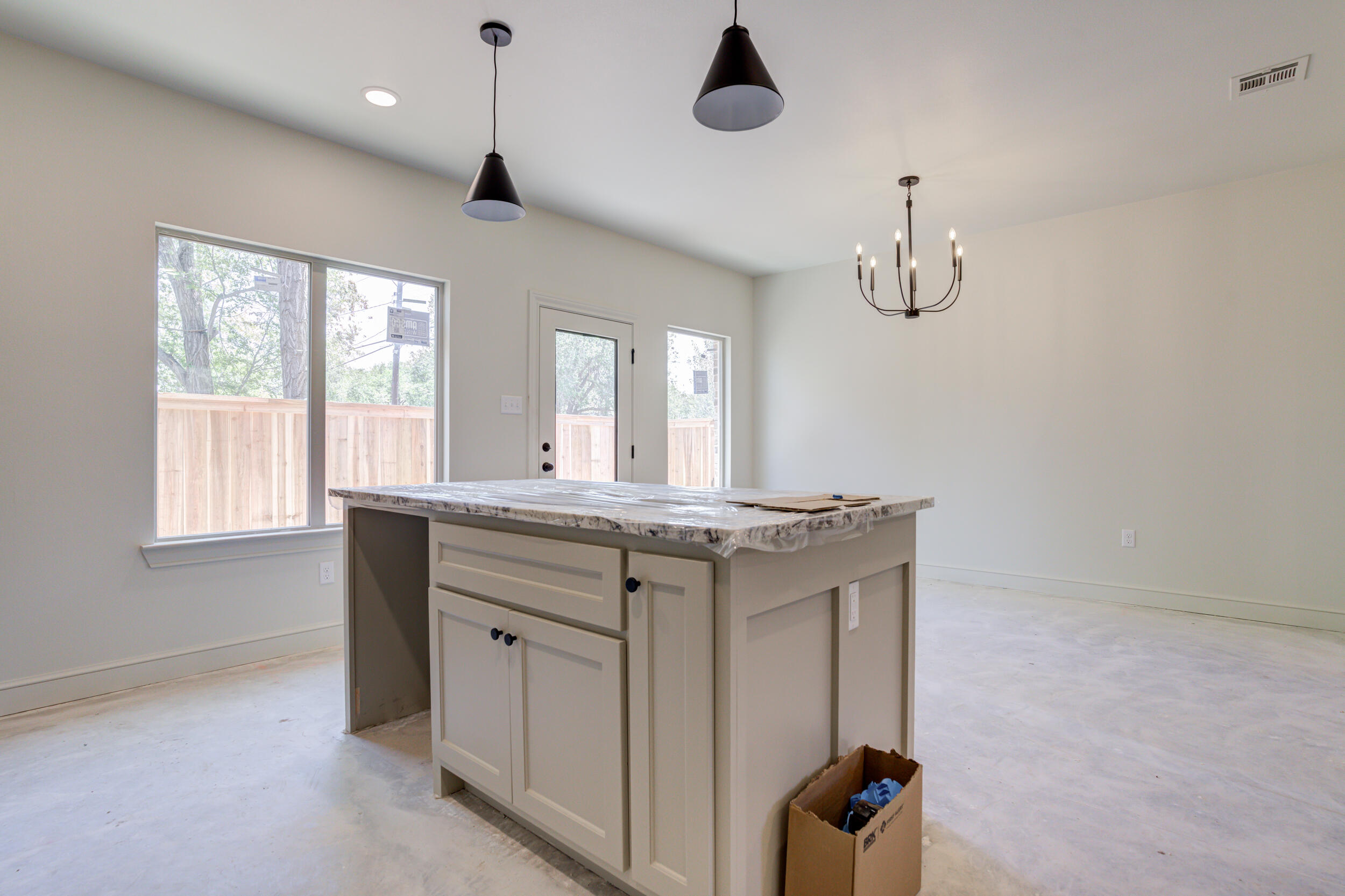3423 24th Street Lubbock, TX 79410 - Photo 20 of 45 a bathroom with a granite countertop sink a window and mirror