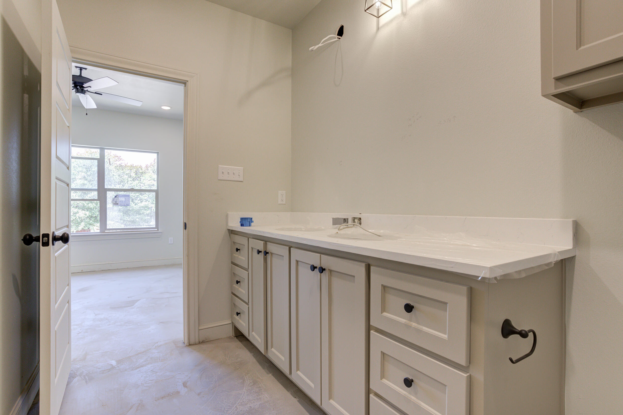3423 24th Street Lubbock, TX 79410 - Photo 29 of 45 a spacious bathroom with a shower sink and mirror