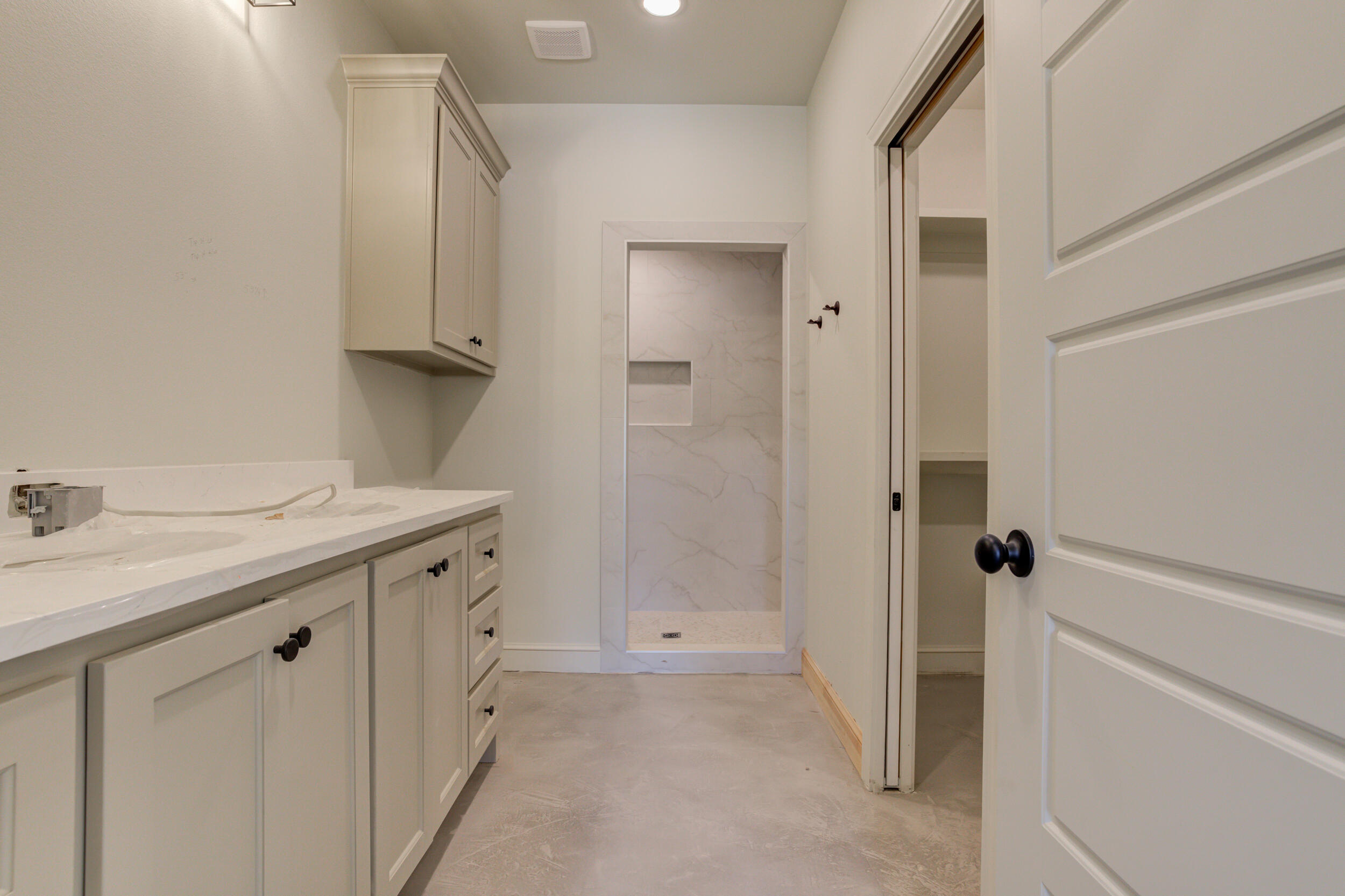3423 24th Street Lubbock, TX 79410 - Photo 31 of 45 a bathroom with a sink and mirror with toilet