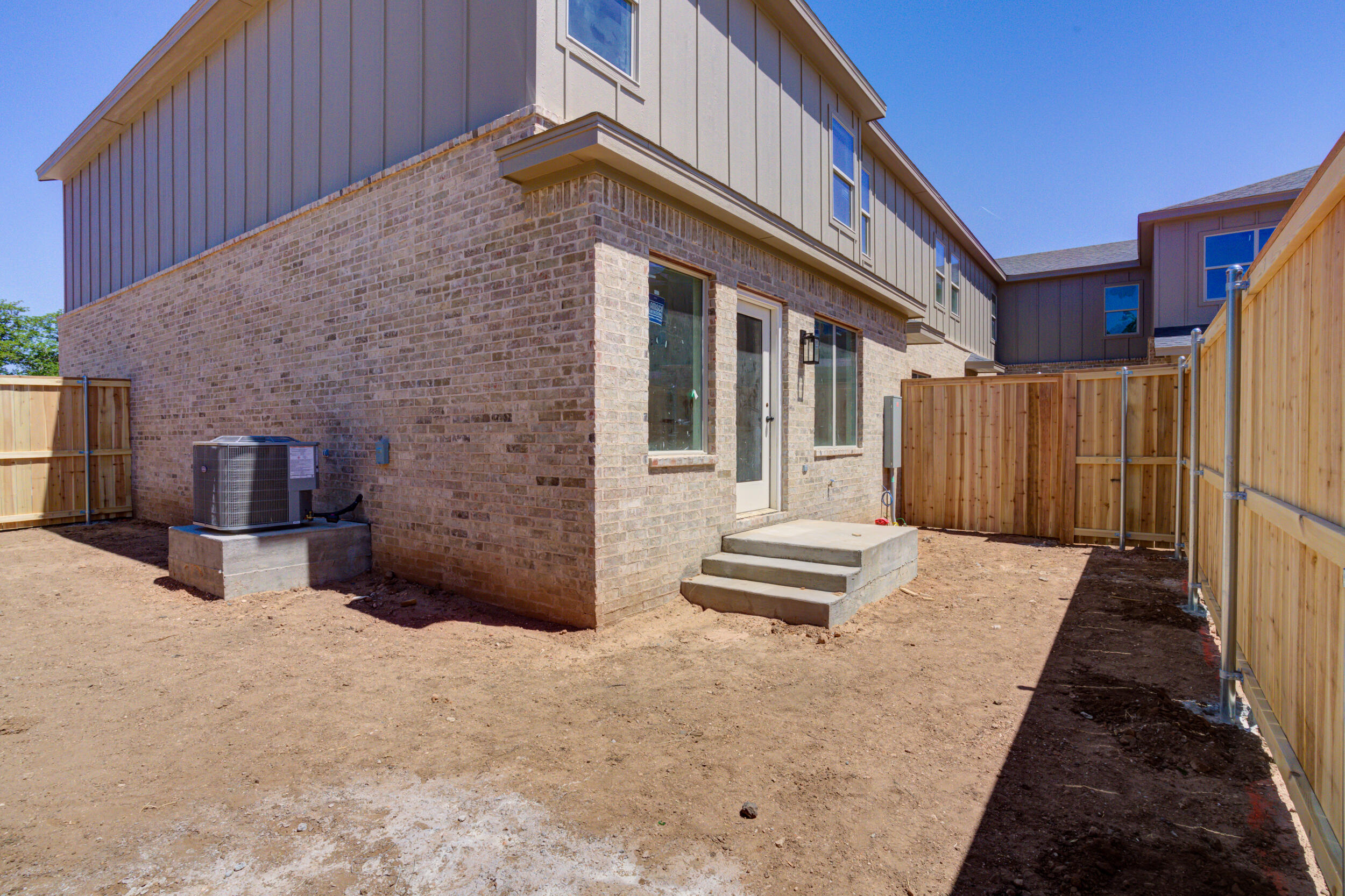 3423 24th Street Lubbock, TX 79410 - Photo 44 of 45 a backyard of a house with barbeque oven and outdoor seating