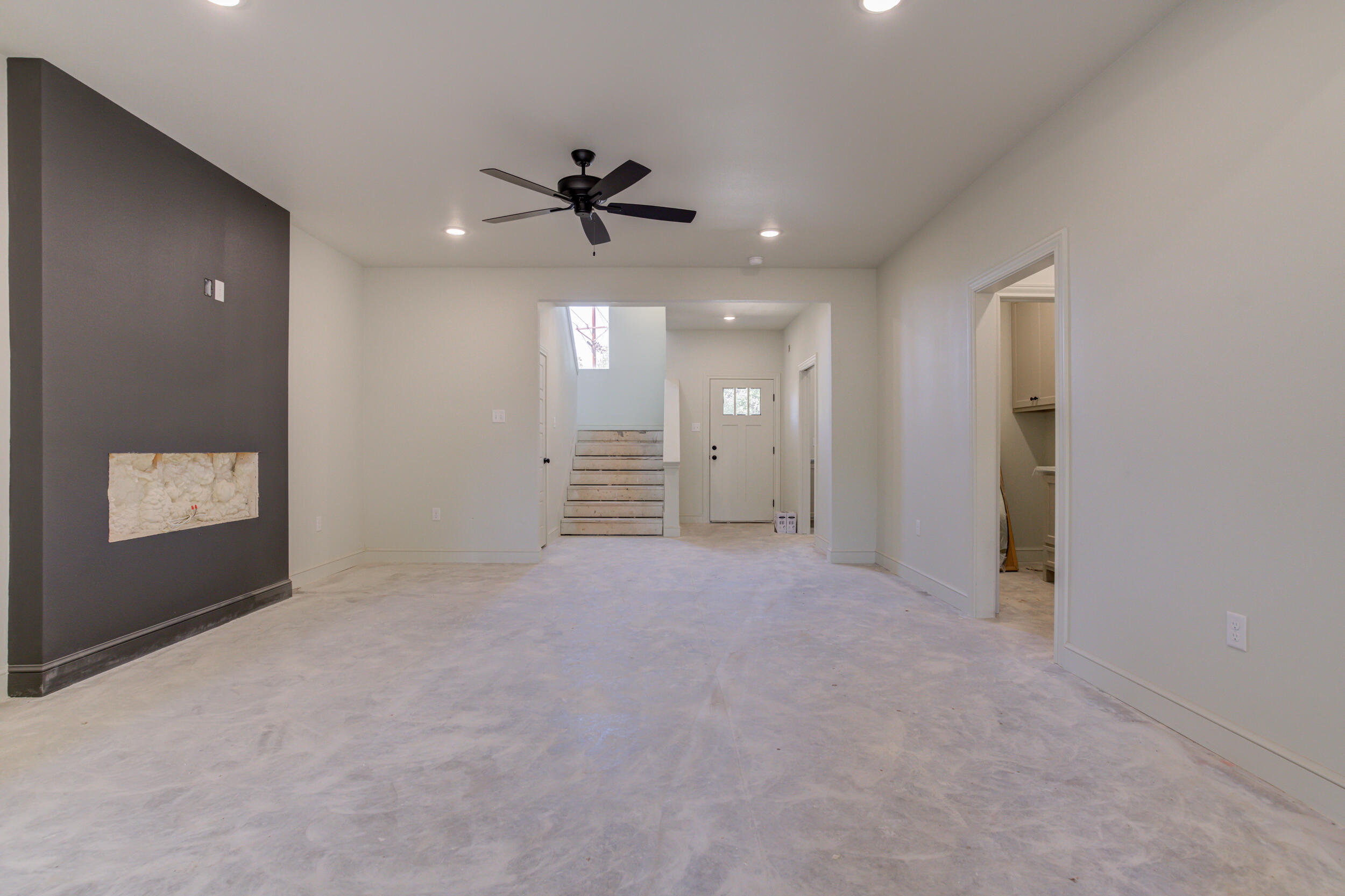 3423 24th Street Lubbock, TX 79410 - Photo 9 of 45 an empty room with windows and cabinet