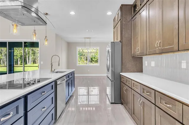 a kitchen with a sink stove and cabinets